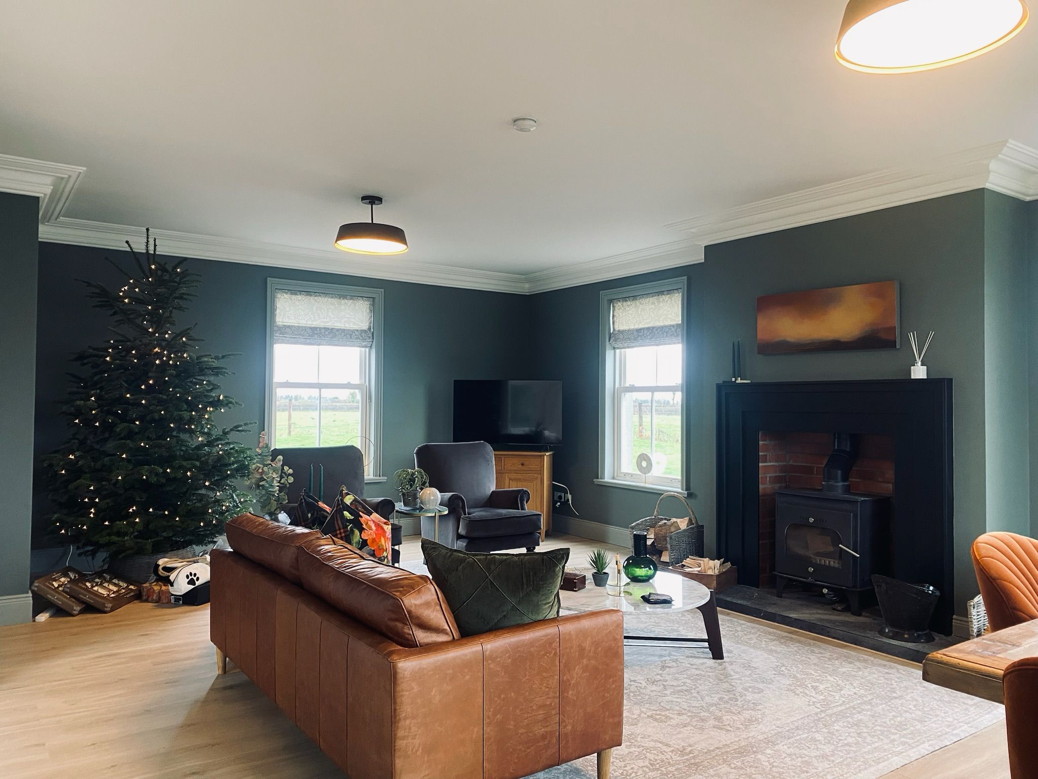 The main living room with a second wood-burning stove